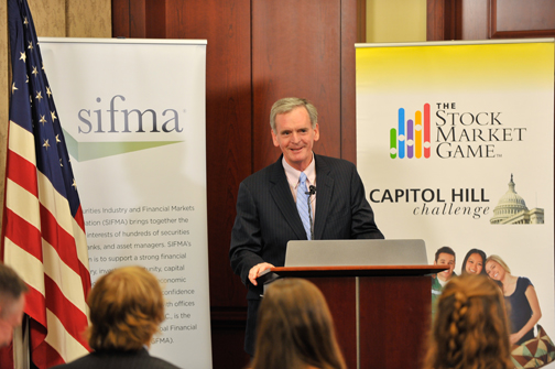 SIFMA CEO Judd Gregg discussing the importance of financial literacy at the Awards Reception